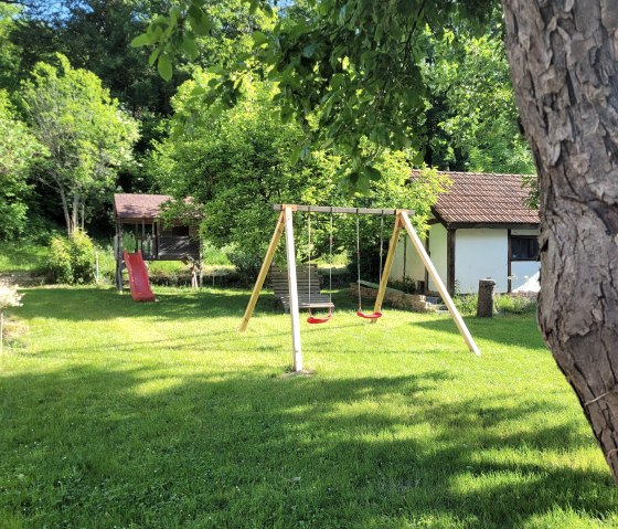 Garten und Kinderspielplatz der Irreler Mühle, © Irreler Mühle Ferienwohnungen & -häuser